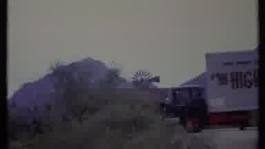 California USA (1971): Old Semi Truck Parked In Desert Looking At Mountain Range