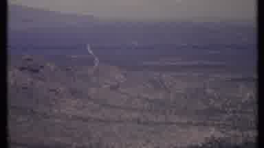 California USA (1971): This Is A Wide Shot Of A Vast Desert With Green Shrubbery