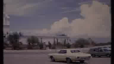 California USA (1971): Cars Are Parking Front Of The Bungalow And Mountain