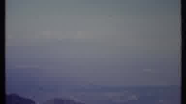 California USA (1971): Foggy Night Sky Scene Including Mountain Peaks And Clouds