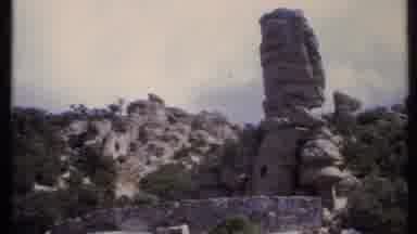 California USA (1971): Rock Formation And Green Trees On A Bright Sunny Day
