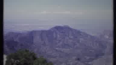 California USA (1971): High Angle A Mountain Range Overlooking A Valley