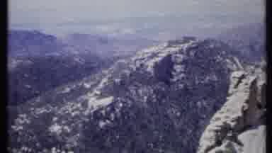 California USA (1971): Ariel Mountains Zooming To Rock Formations In Wilderness In