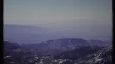 California USA (1971): Grey Forest Skyline High Above Mountains With Rocks