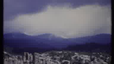 California USA (1971): High Rocky Mountains With Some Green And Clouds In The Sky