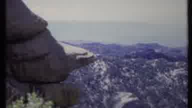 California USA (1971): Huge Open Field Below With Trees Then Panning Towards Huge