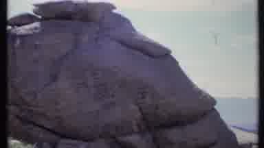 California USA (1971): Rock Formations Towering Above A Brush Covered Sandy