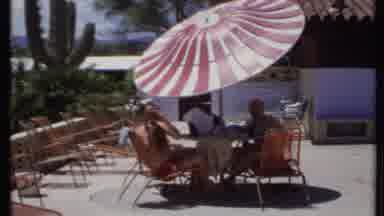 California USA (1971): People Under Shade On A Hot Summer's Day