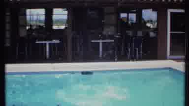 California USA (1971): Kids Swimming In Pool Splashing And Having Fun