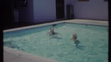 California USA (1971): Three People Enjoy The Shallow End Then Man In Corner Waves