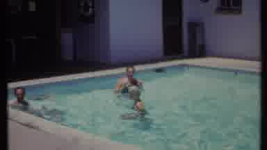 California USA (1971): Summer Vacation Swimming In A Pool In The Desert With