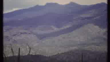 California USA (1971): A Closeup Green Mountains On A Clear Day