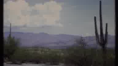 California USA (1971): A Desert Road Stretches Across The Barren Landscape Filled