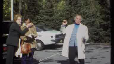 Ithaca New York (1979): Women Exchanging Affection While A Man In A White Coat Is