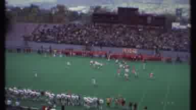 Ithaca New York (1979): A Football Game Is Being Played On A Field Of Green