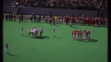 Ithaca New York (1979): Sports Fans Of Varying Ages Watch Players In Red And White