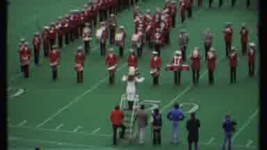 Ithaca New York (1979): Band Leader Leading A Marching Band With Red And White On