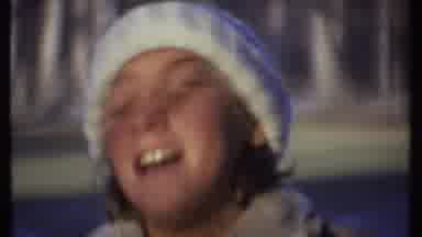 Ithaca New York (1979): A Girl In A White Ribbed Hat And Brown Coat Looks Up And
