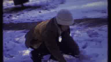 Ithaca New York (1979): Woman Wearing White Hat Plays In Snow On A Clear Sunny Day