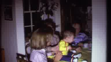 Ithaca New York (1979): People Talking And Chatting Around The Table As Kid Sits