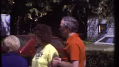 Ithaca New York (1979): Baby Wearing Red Sweater Sits In Red White And Blue