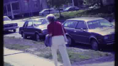 Vermont USA (1984): Woman With Purse Very Slowly Moves Away Up The Walk