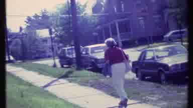 Vermont USA (1984): Elderly Lady Walking Down The Sidewalk With Her Purse And