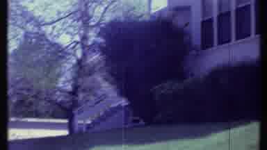 Vermont USA (1984): A White Three Story House With Windows And Bushes
