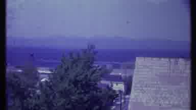 Vermont USA (1984): Rooftop Mountains In The Distance And A Tall Chimney