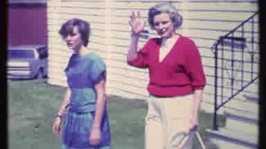 Vermont USA (1984): Lady In Red Sweater Exits Wave And Points As She And Another