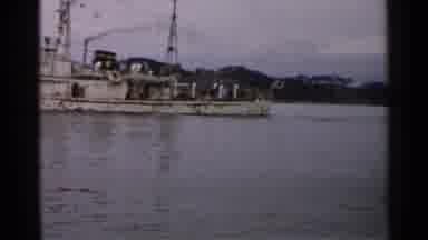 Japan (1952): Boat Sailing On Water In Front Of Mountains