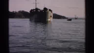 Japan (1952): Large Aircraft Carrier Sitting In The Water Of The Coast