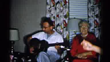 New Hampshire (1952): People Sitting In Living Room Listening To Man Play Guitar