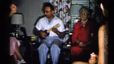 New Hampshire (1952): Man Plays Music Next To Old Lady Then Woman In Chair Looks