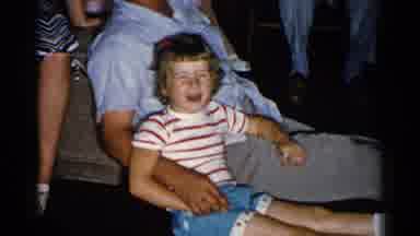 New Hampshire (1952): Man Wearing Blue Shirt Plays Guitar For People Sitting On