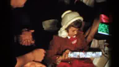New Hampshire (1952): Children Opening Christmas Presents Surrounded By People In