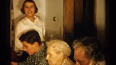New Hampshire (1952): A Woman Serves Food To A Group Of Family Members At A Eating