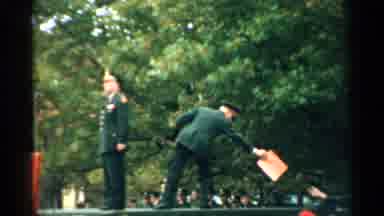 New Hampshire (1952): A Military Member Stands Behind Another And Passes A Folder