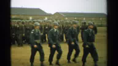 New Hampshire (1952): An Army In Full Uniform With A Flag Marches In A Field By