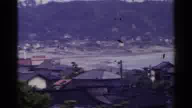 Japan (1953): Small Seaside Town In Asia Have A Large Metal Statue Of Buddha