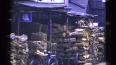 Japan (1953): A Whole Bunch Of Woods Stacked Up At What Appears To Be A Market