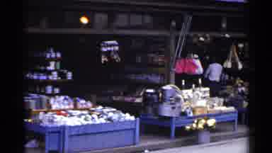 Japan (1953): Outside Market Selling Food And Objects With A Men Standing Inside