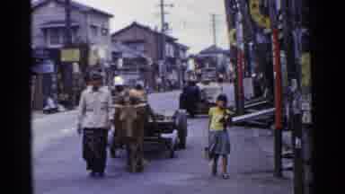 Japan (1953): People On The Street Of The City Work On The Commerce