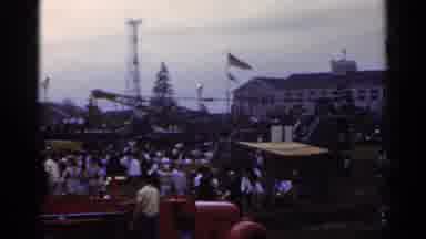 Japan (1953): Large Crowd Of People Gathering For An Event In Front Of A Large