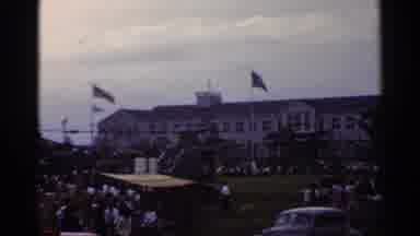 Japan (1953): A Public Place With People Cars Grass The American Flag And The Un