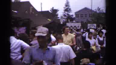Japan (1953): A Group Of Lots Of People Gathering Around For Something