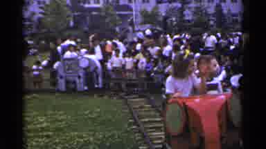 Japan (1953): Small Children Ride In Elephant Shaped Cars On Train Track Type Ride