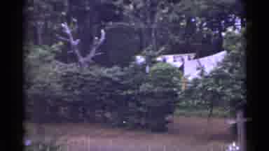 Japan (1953): Camera Pans From Above With Materials Hung To Dry And Roof Of Home