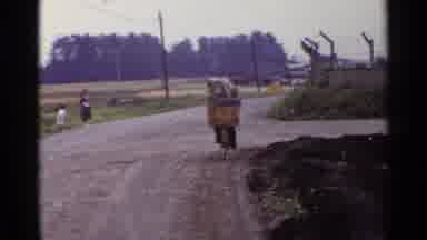 Japan (1953): Man Cycling Down Rural Road