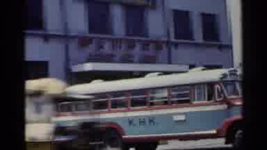 Japan (1953): The Camera Pans Across The Scene And Captures Buildings And People